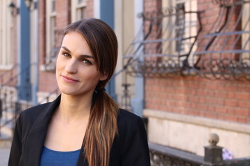 Stunning young woman with ponytail on the side and copy space on the right 