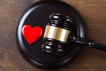Mallet And Heart On Table In Courtroom