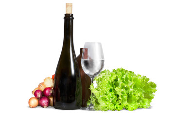 Group of various vegetables, greenery with water glass and bottl