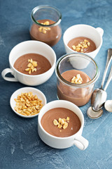 Obraz na płótnie Canvas Chocolate yogurt dessert with salted peanuts
