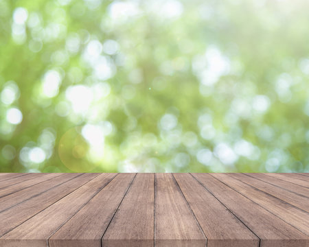 Wooden table and bright spring bokeh background - can be used for display your products