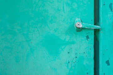 Background old metal door painted in green color. Free text spac