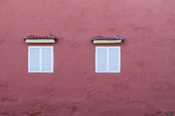 House wall with two windows