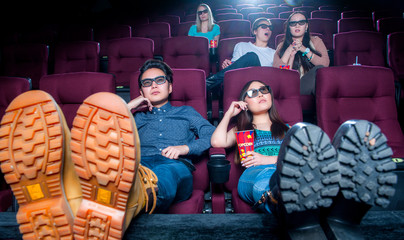 Obraz na płótnie Canvas People in the cinema wearing 3d glasses