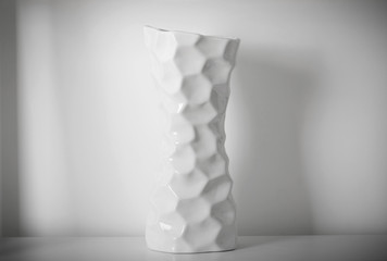 white vase on white shelf