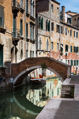 Fototapeta na wymiar Bridge and Historical Facades in Venice, Italy