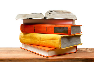 Open book, hardback books at wooden shelf isolated on white background. Back to school. Copy space for text