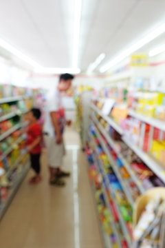 father and son as customer looking for shopping in convenience s