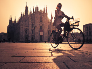 Woman cycling in Milan - 101976127