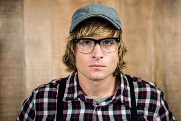 Serious blond hipster staring