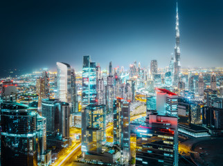Fototapeta na wymiar Scenic aerial view of a big modern city at night. Business bay, Dubai, United Arab Emirates.