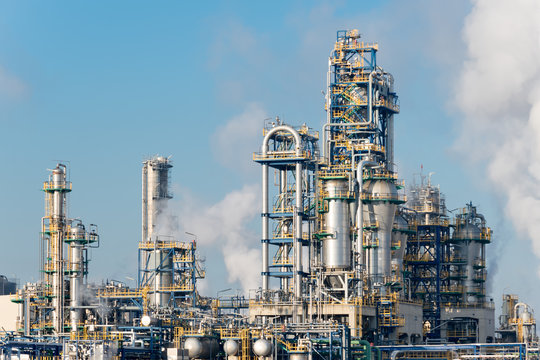 Detail of smoking chimneys of a plastic manufacturing factory