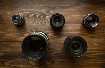 Top view of camera lenses organized in shape of Olympic emblem