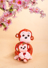 Chinese lunar new year ornaments toy of monkey on festive backgr