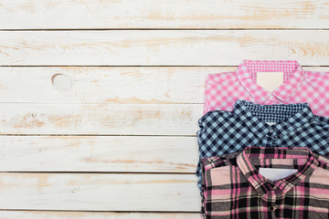Woman's clothes on wooden background