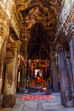 Buddha's statue inside Banteay Kdei Temple  Angkor, Cambodia. An