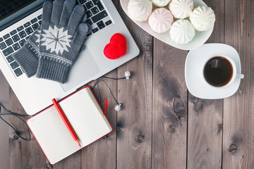 working at night, laptop and cup of coffee on table