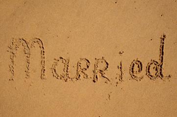 sign Married written in sand.