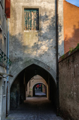 Fototapeta premium Narrow passway in downtown in Chioggia