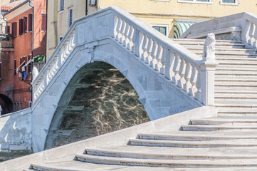  Ancient bridge with marble stairway in Chioggia