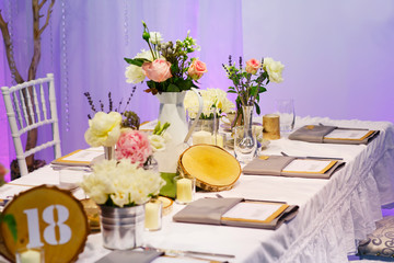 Elegant table set in green and white for wedding or event party.