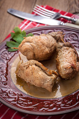 Rolls pork on the plate.