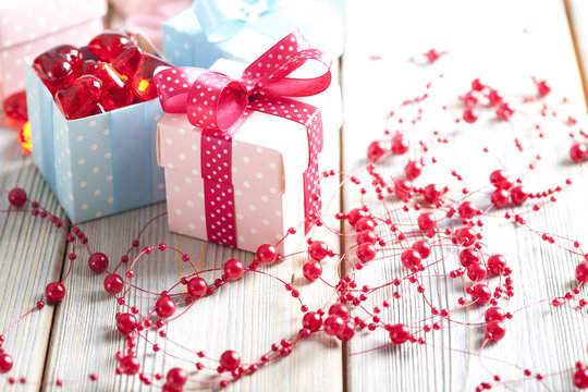 Colored gift boxes on wooden background