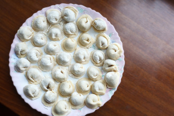 Meat dumplings russian pelmeni on dish