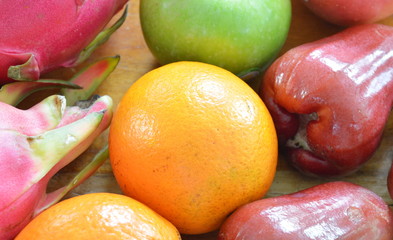 orange and tropical fruit on table