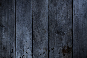 Gray background of wooden planks arranged vertically.