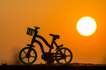 Fototapeta na wymiar Silhouette motocycle and the morning sun