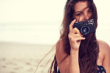 Close up Portrait of beautiful  woman with retro hipster camera