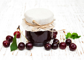 Cherry jam with fresh berries