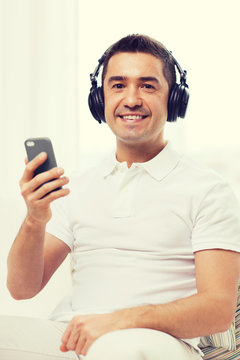 happy man with smartphone and headphones
