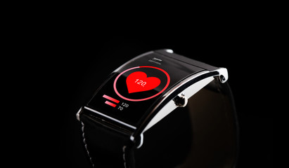 close up of black smart watch with heart rate icon