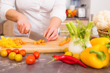 Woman cutting vegetables 