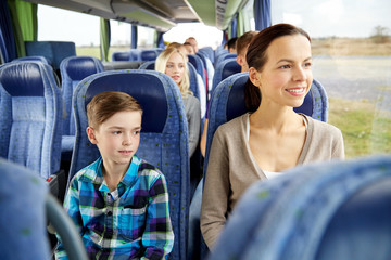 Fototapeta na wymiar happy family riding in travel bus