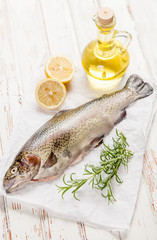 Fresh trout on white wood