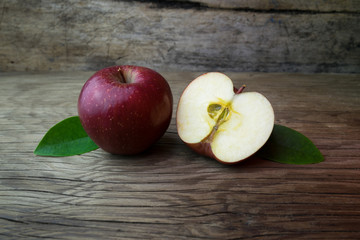 Naklejka na ściany i meble Red apples on a wooden table