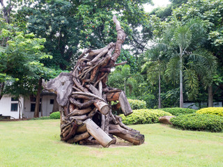 Old wood carving elephant in garden