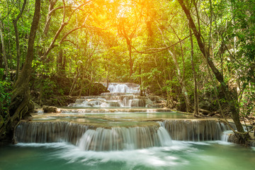 Beautiful waterfall, deep forest waterfall, Huay Mae Kamin waterfall in Kanchanaburi, Thailand on sunlight.