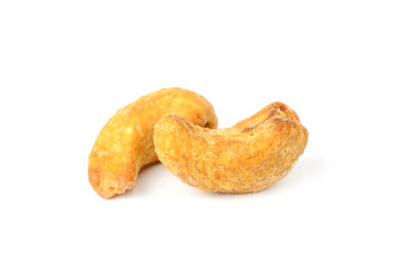 Salted and roasted cashew nut isolated on white