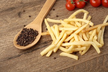 French fries on a wooden background
