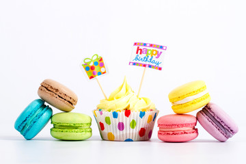 Collection of brightly colored French macarons on white background