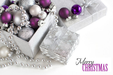Fototapeta na wymiar Silver and purple Christmas ornaments border