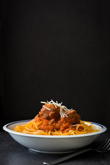 Spaghetti and meatballs.black background
