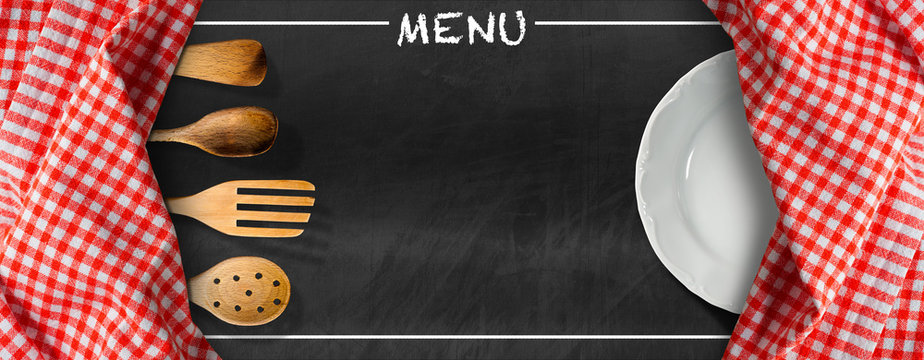 Menu - Blackboard with Kitchen Utensils and Plate / Blackboard with red and white checkered tablecloth, text Menu, wooden kitchen utensils and white empty plate. Template for a food menu