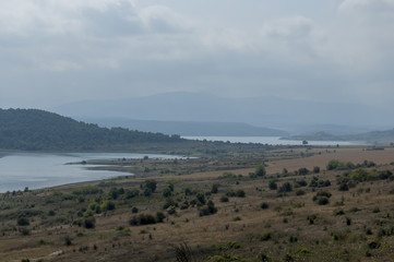 View of largest  reservoir Ogosta gather water with fisherman in shore, Bulgaria  