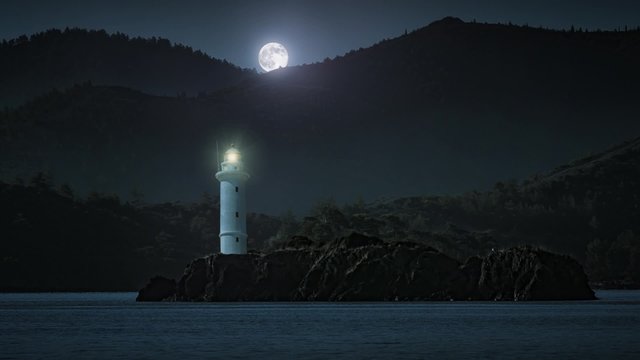 Lighthouse at night with full moon