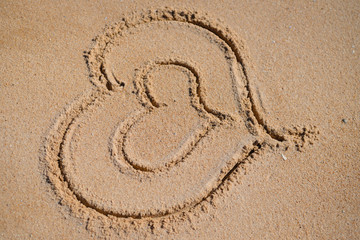 Fototapeta na wymiar Hearts drawn on the sand of a beach